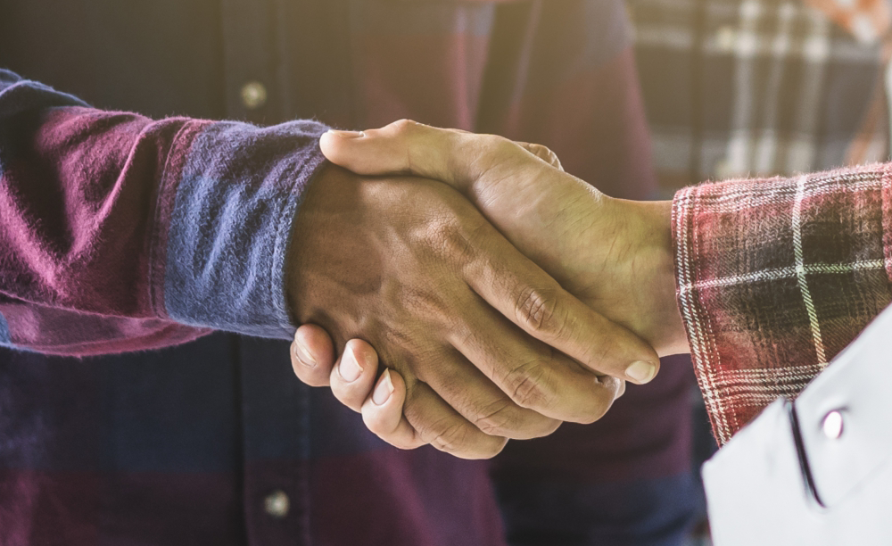 two people shaking hands