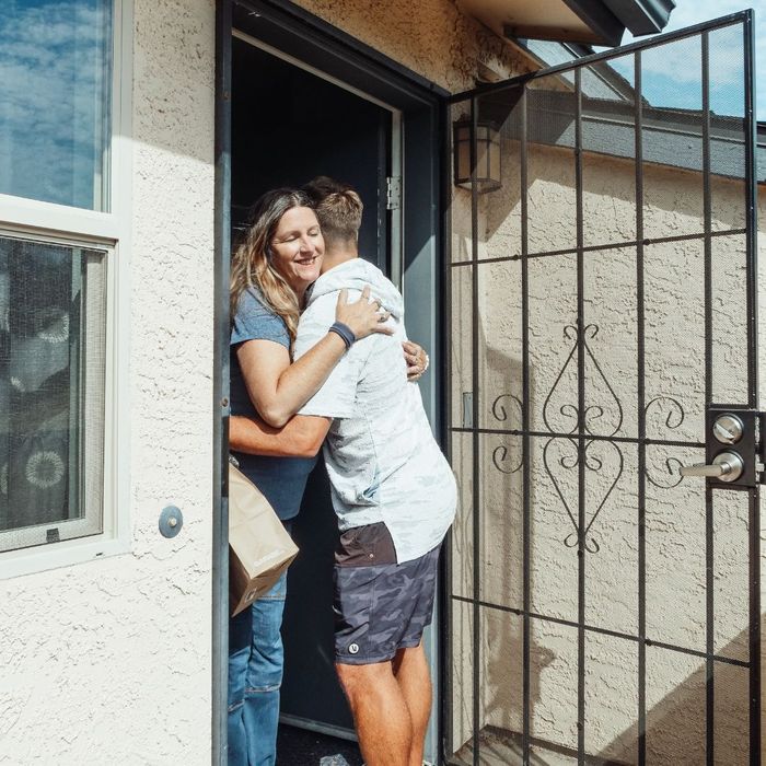 Neighbors hugging.