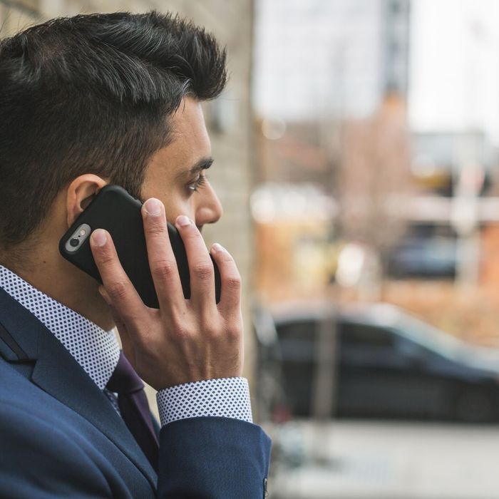 man reporting locksmith on cell phone