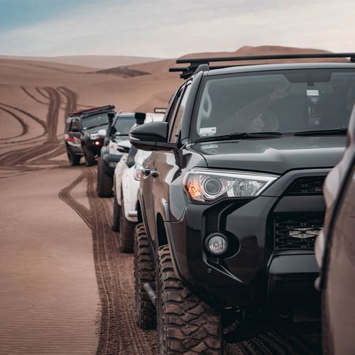 row of offroad tucks in desert