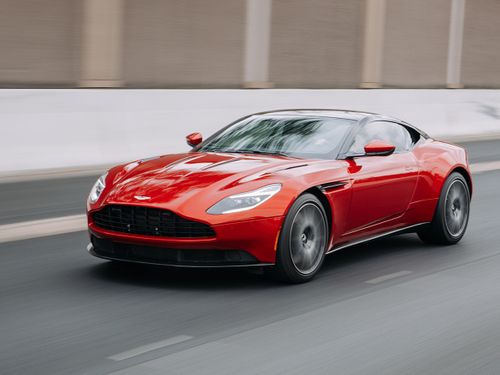 photo of red car driving n the highway