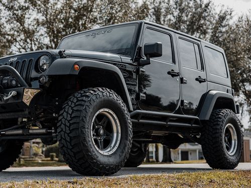 Black Jeep with tinted windows