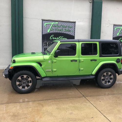 Green jeep with window tint