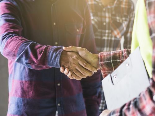 photo of two men shaking hands