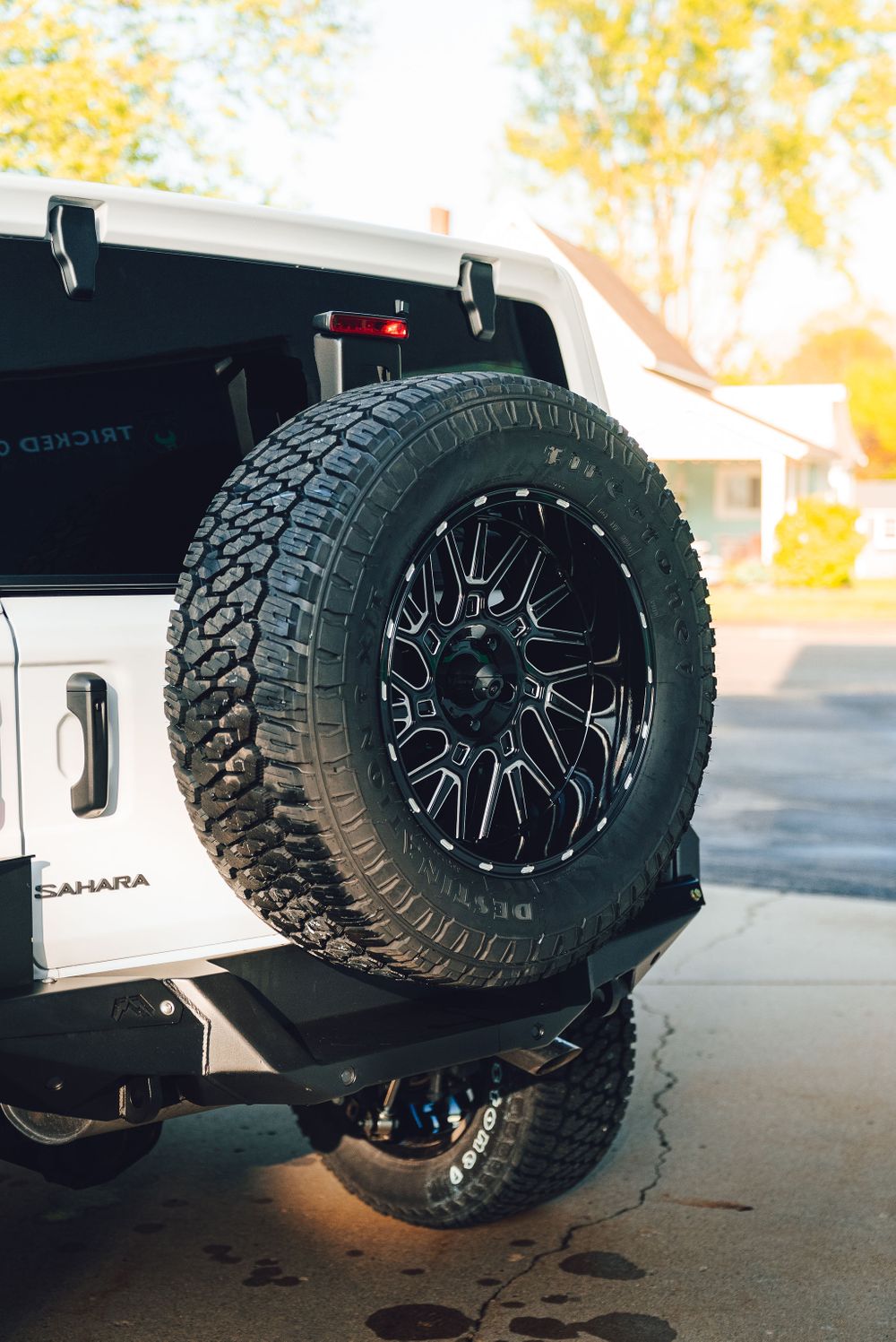 Fab Fours heavy duty rear bumper and tire carrier on a lifted Jeep Wrangler.