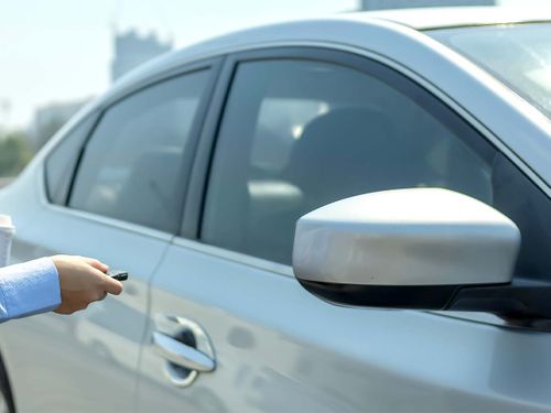 A silver car being started remotely