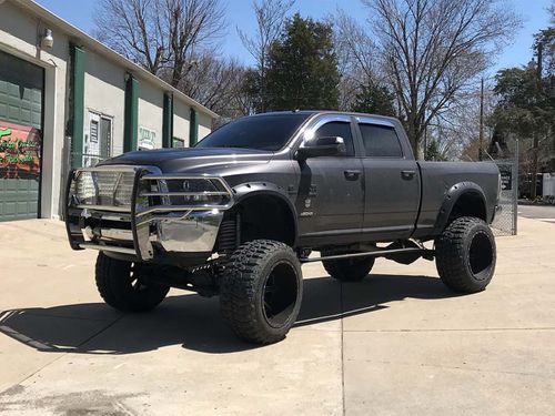 A big black truck at Tricked Out Car and Truck Sales