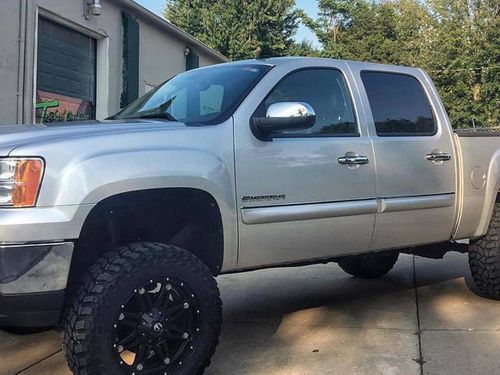 GMC Sierra with lift kit installed by Tricked Out Truck Sales