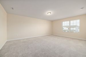Bedroom with new light gray carpet