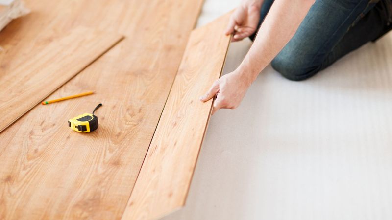Light colored wooden planks being installed