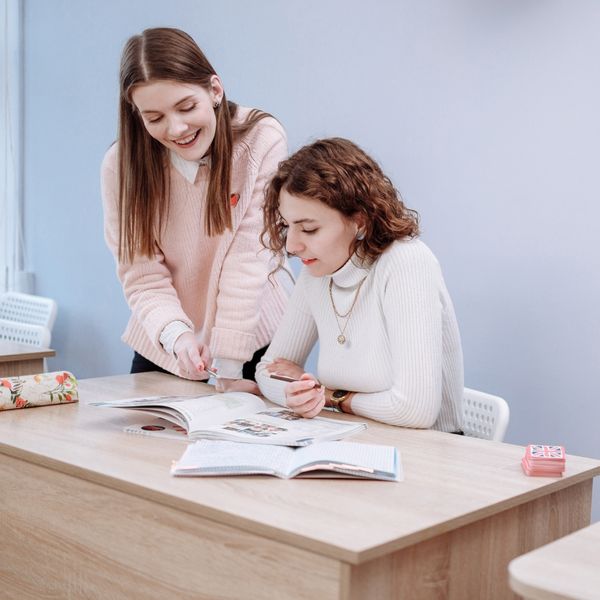 teacher helping student 