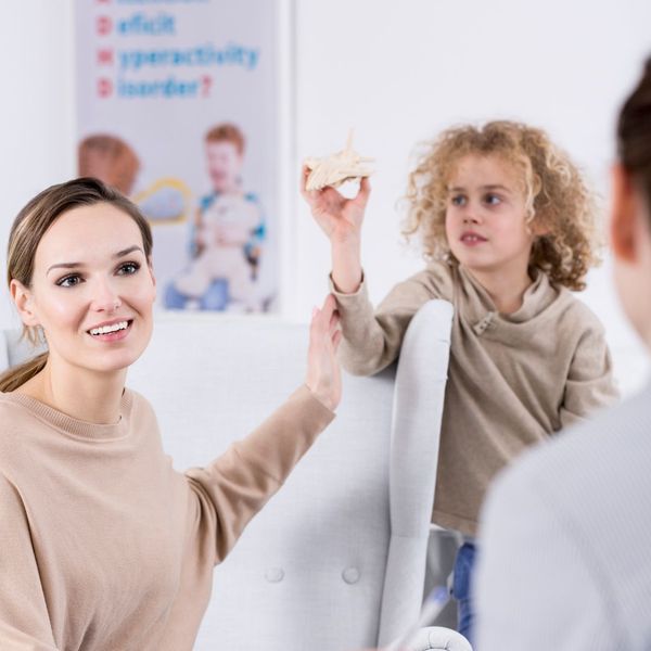 mother and son working with behavior specialist