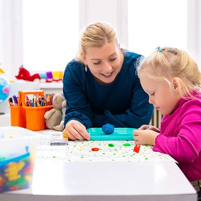 teacher and child working together