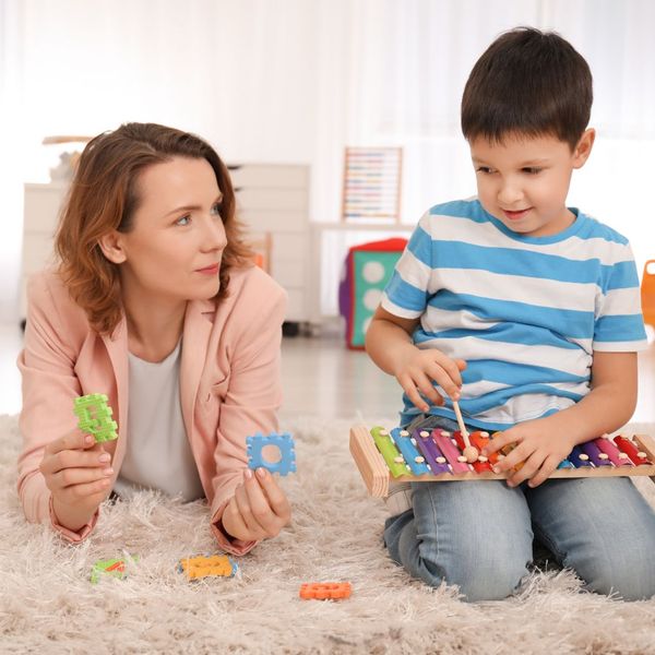 child playing with the xylophone during behavior therapy session