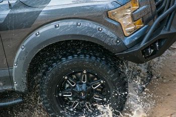 Truck driving through mud