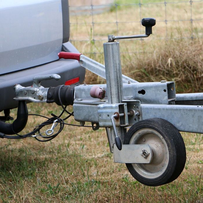 a large trailer hooked up to a truck trailer hitch