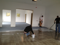 crew finishing concrete floor