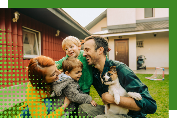 family with dog in yard