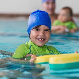 elementary school aged boy getting swim lessons in saint johns florida