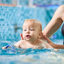 baby getting swim lessons