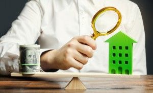 Real estate appraiser estimating the price of a home
