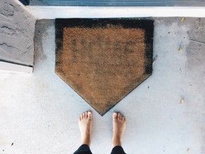 door mat shaped like a home