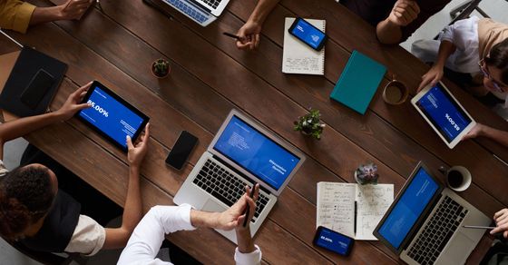 team on laptops