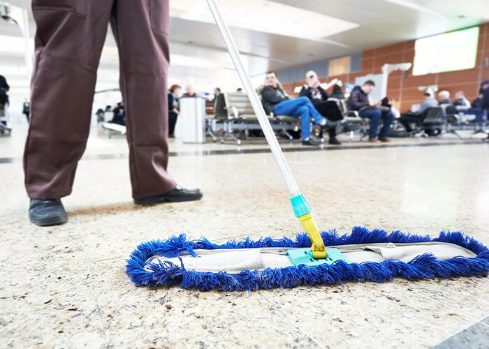 custodian dry mopping medical waiting room