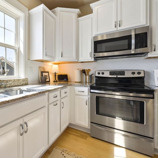 microwave and oven in kitchen