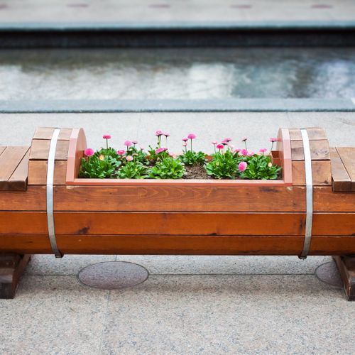 elevated flower bed within a bench