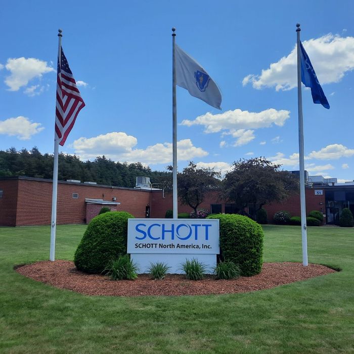 custom sign out side of building with flags