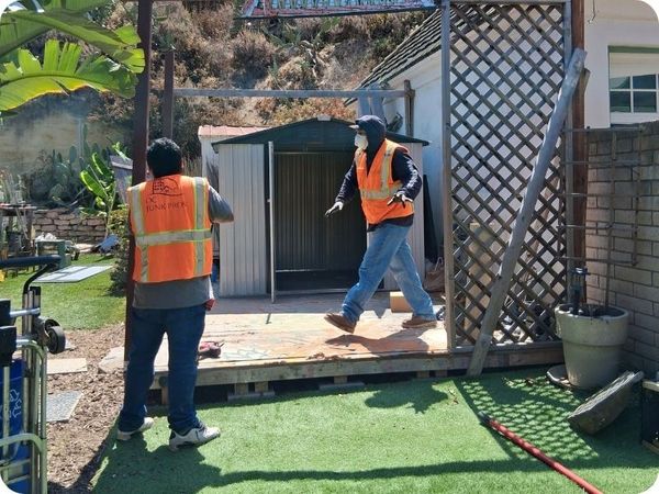 OC Junk Pros removing junk from yard