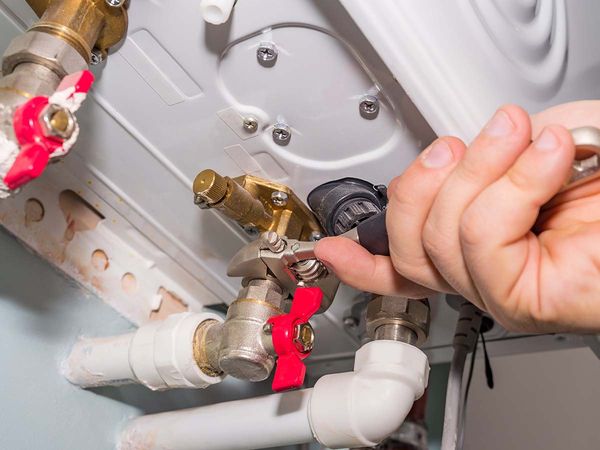 professional working on water heater
