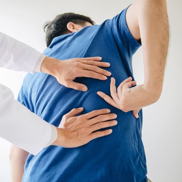 Man getting a back adjustment from a chiropractor