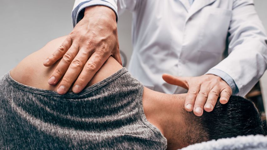 Man gets a neck adjustment from a chiropractor