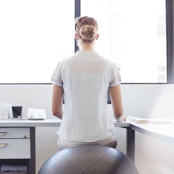 woman with good posture sitting on an exercise ball
