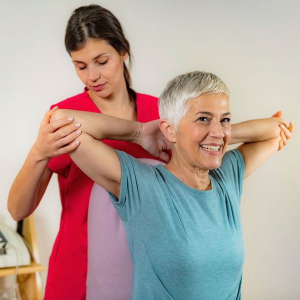 Chiropractor works with elderly woman