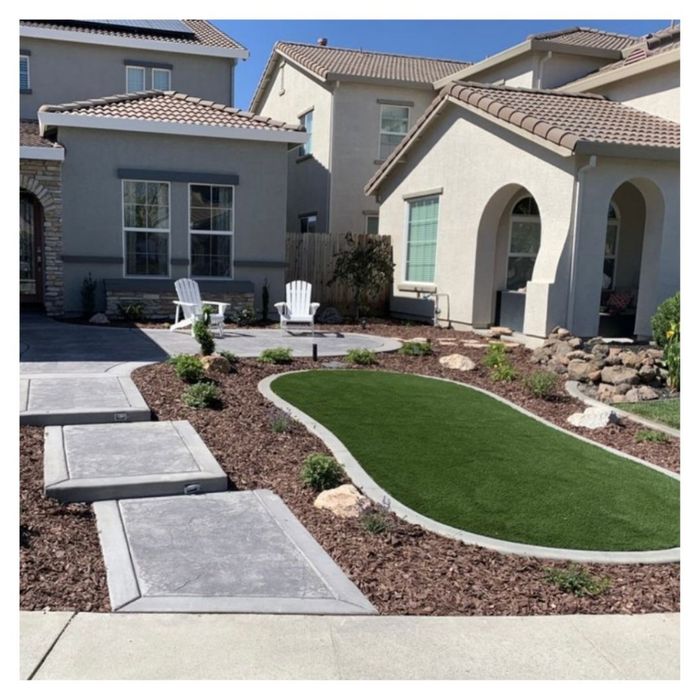 landscaped yard with artificial turf