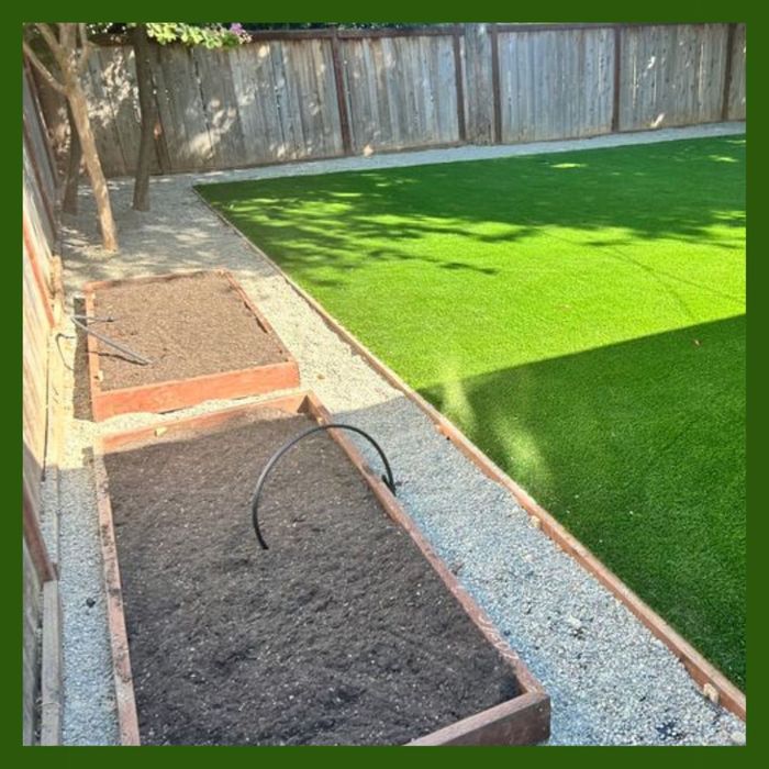 irrigation tube hanging out of a raised garden