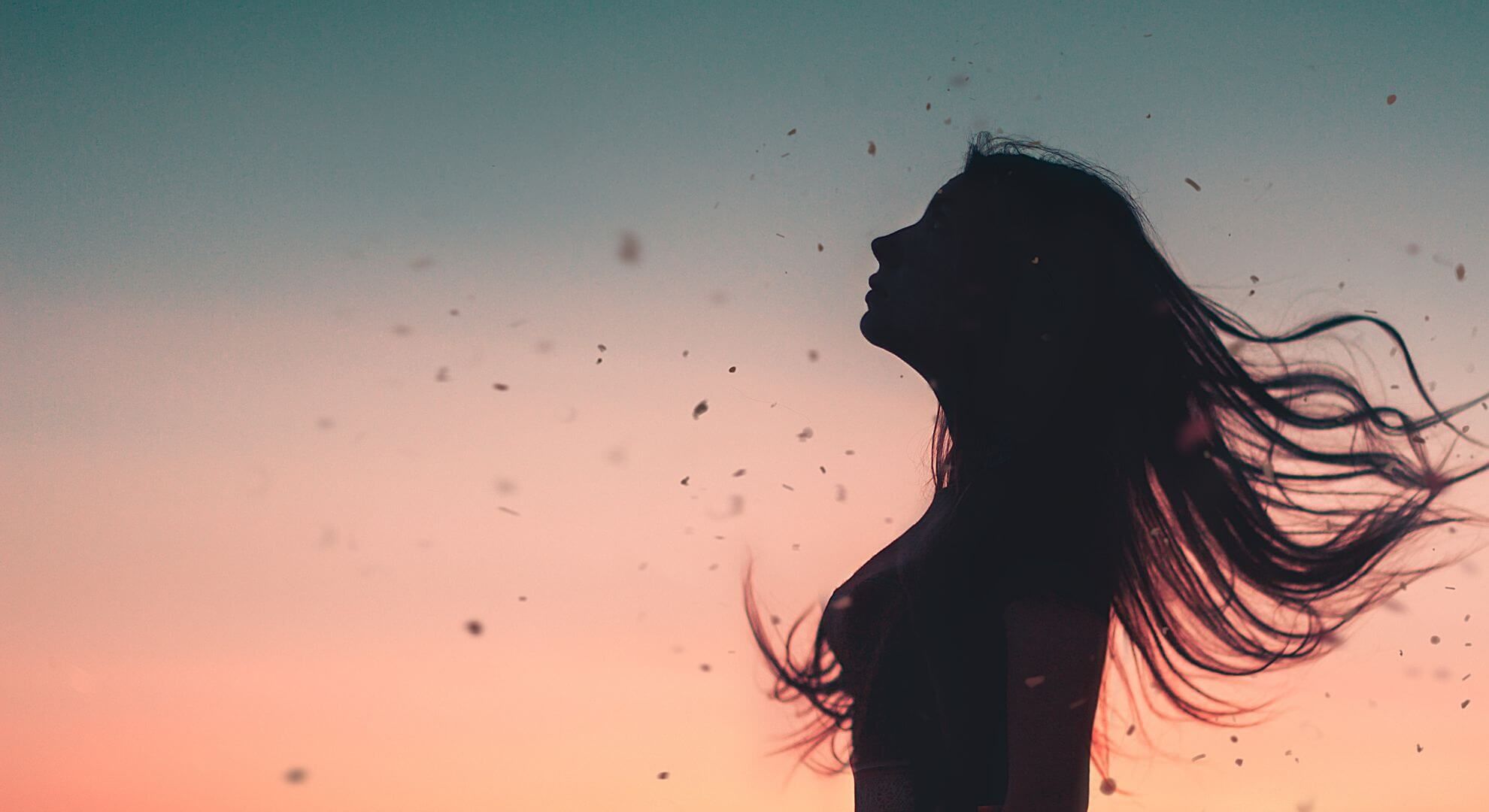 silhouette of woman with flowing hair