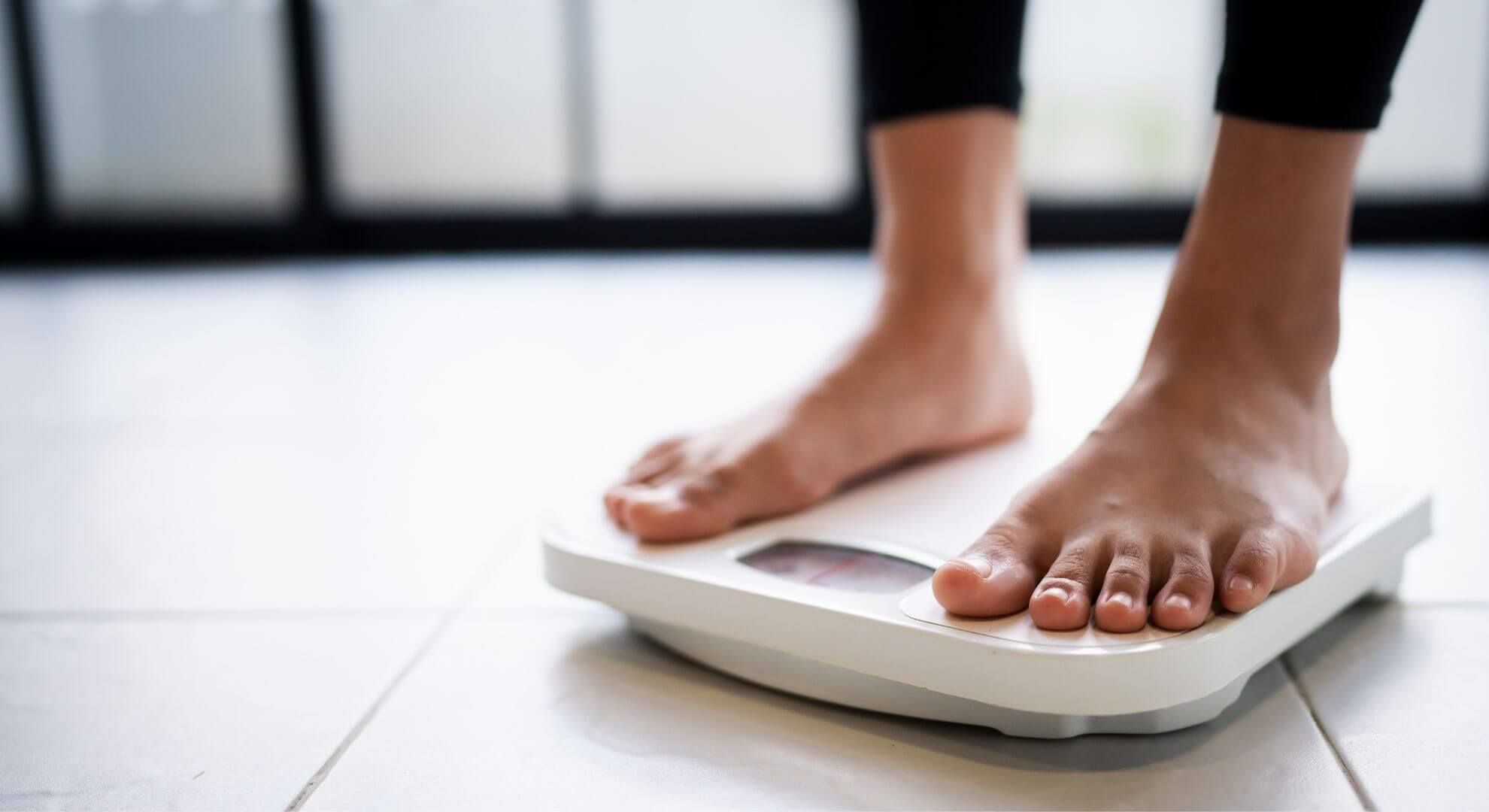person standing on scale