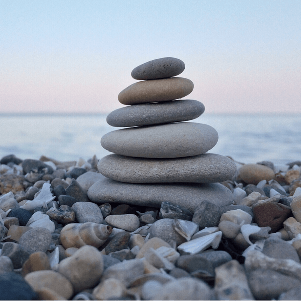 stacked rocks by ocean stacked rocks by ocean