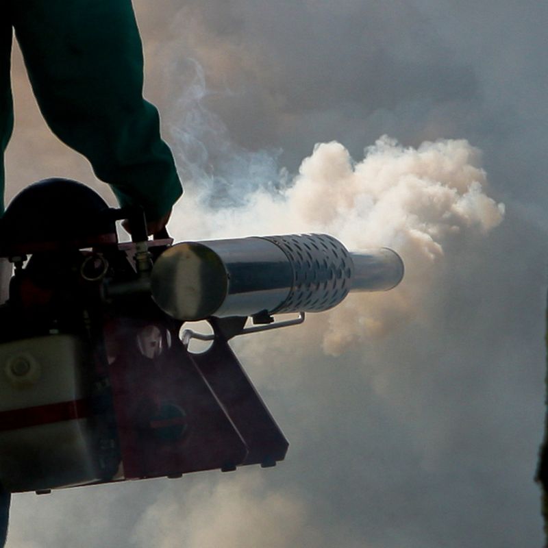 Image of a person using a mosquito fogger 