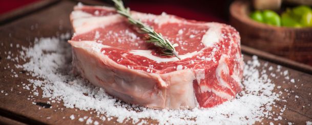 raw steak on a cutting board