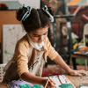 little girl woking on art project