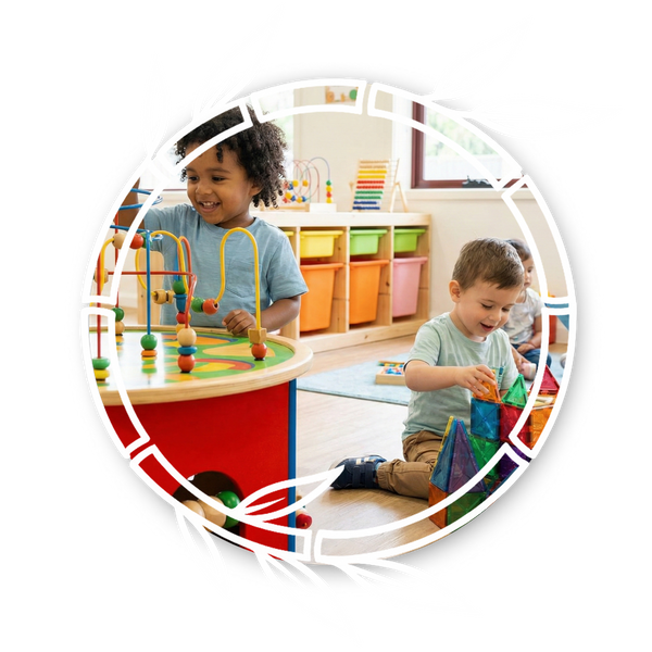 Children at Rainforest Child Care Center engage in play-based learning with a bead maze and magnetic tiles, while a teacher reads to another child.