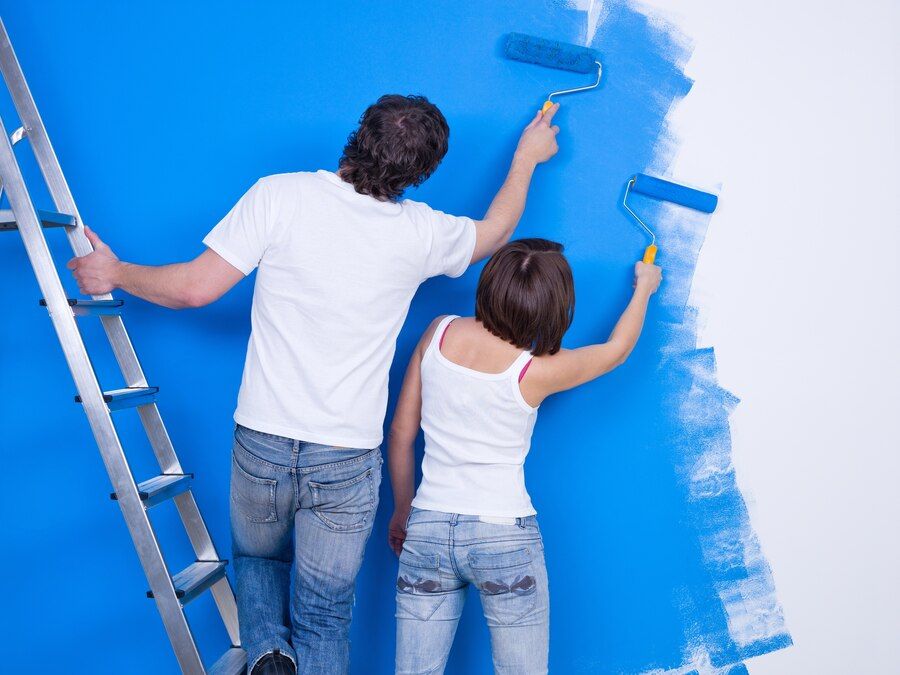 young-couple-painting-wall-with-roller-together_186202-3794.jpeg