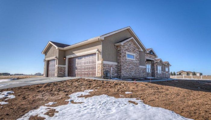 Exterior home with completed stone masonry