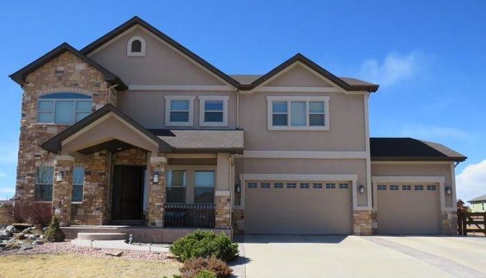 Exterior home with stucco and stone masonry siding