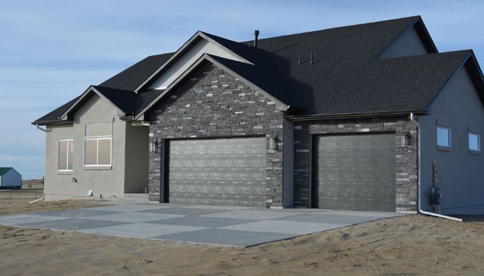 Exterior home with completed stone masonry